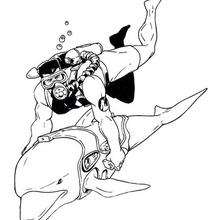 Dibujo para colorear : Action Man con un delfin